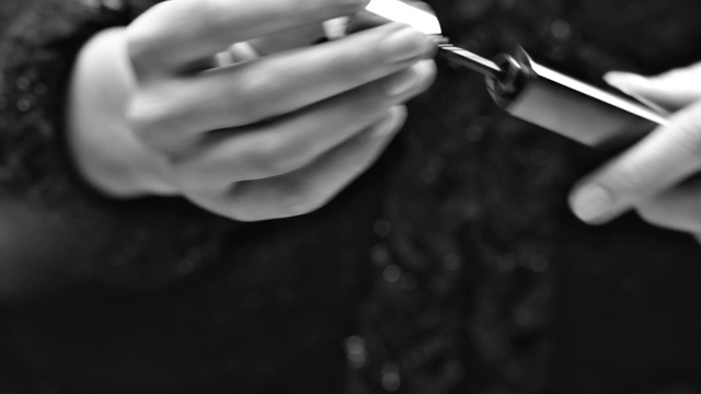 Video Reference: Hand, Finger, Gesture, Eyelash, Style, Thumb, Nail, Black-and-white, Wrist, Audio equipment