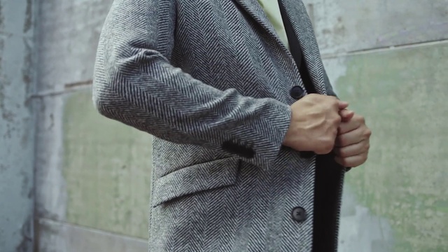 Video Reference: Hand, Outerwear, Arm, Dress shirt, Sleeve, Street fashion, Waist, Gesture, Finger, Grey