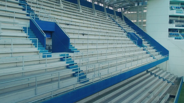 Video Reference: Daytime, Blue, Field house, Architecture, Stairs, Stadium, Landmark, Composite material, Sport venue, Electric blue