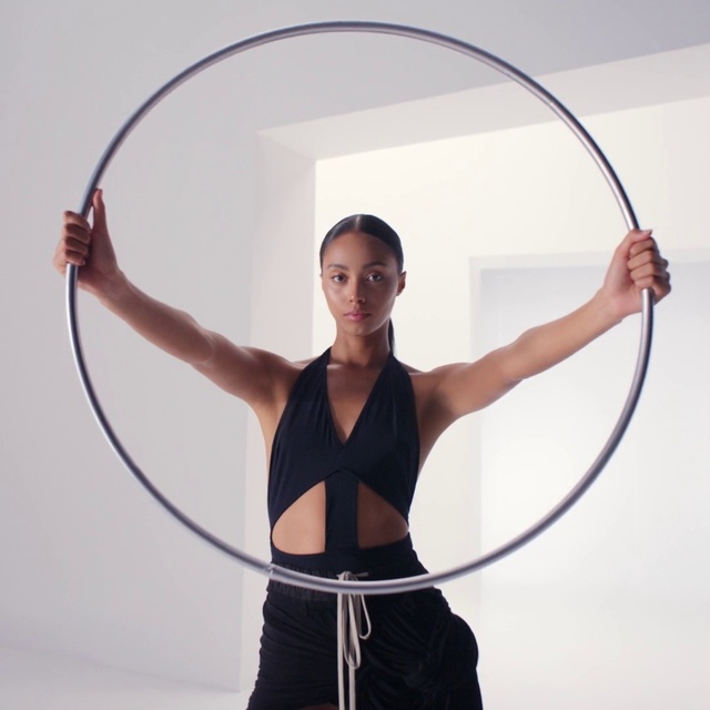 Video Reference: Shoulder, Photograph, White, Entertainment, Waist, Recreation, Performing arts, Elbow, Bow and arrow, Toy