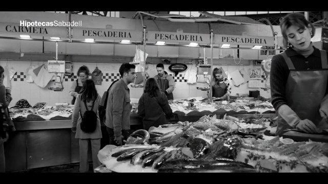Video Reference: fish market, seafood, market stall, vendor, shoppers, indoor market, black and white, fish counter, fresh seafood, market scene, retail, food