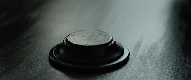 Video Reference: Coin, Currency, Nickel, Metal, Font, Fashion accessory, Circle, Plastic, Macro photography, Still life photography