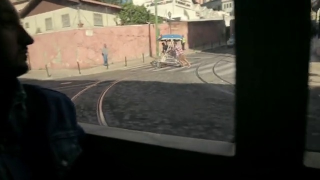 Video Reference: Window, Road surface, Asphalt, Rolling, Automotive exterior, Urban design, Sidewalk, Hat, Art, Road