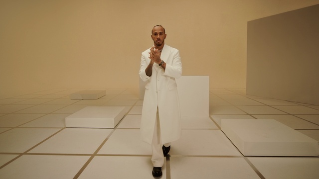 Video Reference: Dress shirt, Sleeve, Gesture, Flooring, Suit, Blazer, Formal wear, Fashion design, Event, Art