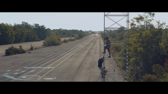 Video Reference: Sky, Plant, Tree, Road surface, Asphalt, Natural landscape, Line, Bridge, Thoroughfare, Grass