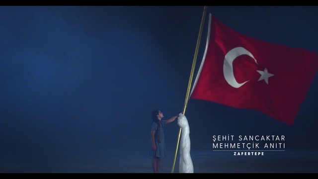 Video Reference: Flag, Font, Red flag, Electric blue, Event, Wind, Sky, Pole, Logo, Brand