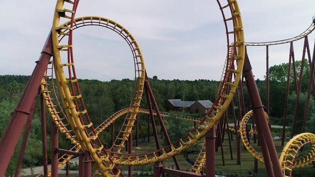 Video Reference: Sky, Cloud, Tree, Outdoor recreation, Leisure, Roller coaster, Fun, Recreation, Pole, Amusement ride