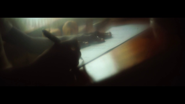 Video Reference: Gesture, Tints and shades, Font, Darkness, Display device, Shadow, Windshield, Fin, Visual arts, Room