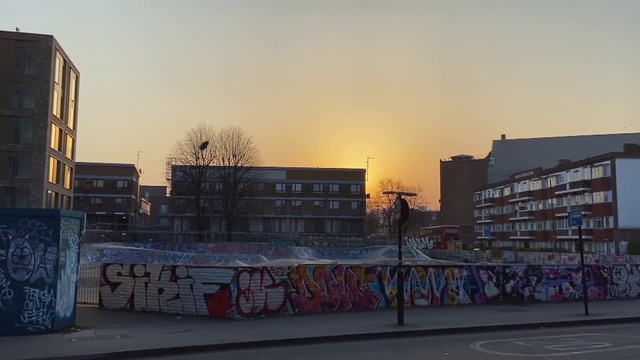 Video Reference: Sky, Building, Window, Road surface, Tree, Sunlight, Neighbourhood, Asphalt, Residential area, Art