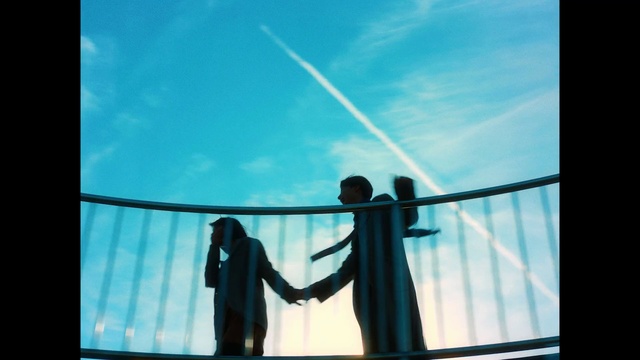 Video Reference: Sky, Cloud, Azure, Gesture, Tints and shades, Electric blue, Rectangle, Glass, Symmetry, Metal