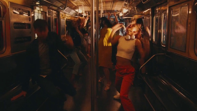 Video Reference: Shorts, Train, Mode of transport, Vehicle, Flash photography, Sunglasses, Public transport, Passenger, Chest, Event