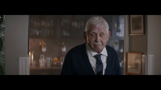 Video Reference: Tie, Flash photography, Collar, Dress shirt, Blazer, Wrinkle, Event, Suit, Formal wear, White-collar worker