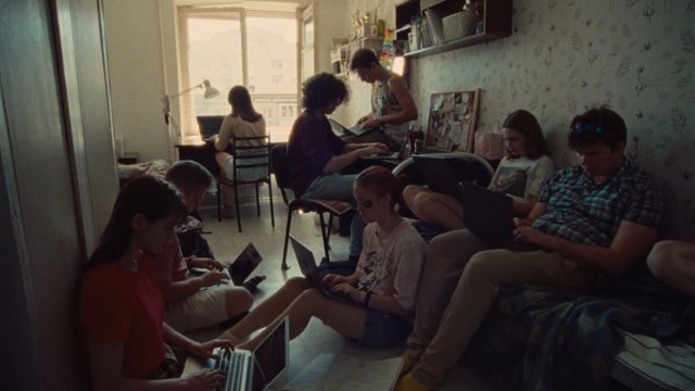 Video Reference: indoor, bedroom, students, laptops, working, study, group, young people, shared room, window light, casual, technology, home, teamwork