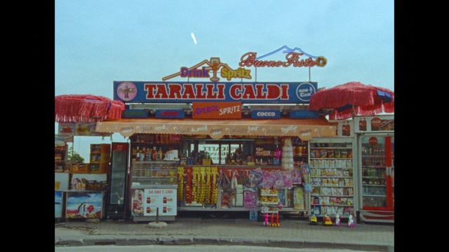 Video Reference: Sky, Building, Facade, Door, Retail, City, Font, Event, Logo, Tourism