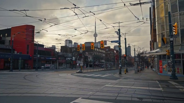 Video Reference: Cloud, Sky, Building, Daytime, Road surface, Electricity, Asphalt, Residential area, Overhead power line, Dusk