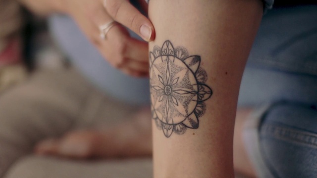 Video Reference: Hand, Sleeve, Gesture, Finger, Temporary tattoo, Elbow, Nail, Wrist, Tattoo, Font