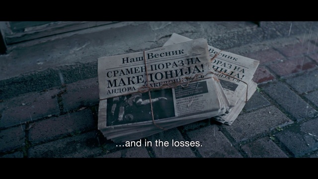 Video Reference: Newspaper, Asphalt, Road surface, Publication, Font, Automotive exterior, News, Motor vehicle, Road, Auto part