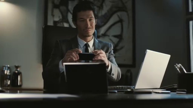 Video Reference: Computer, Laptop, Personal computer, Coat, Tie, Gesture, Suit, Netbook, Blazer, Spokesperson