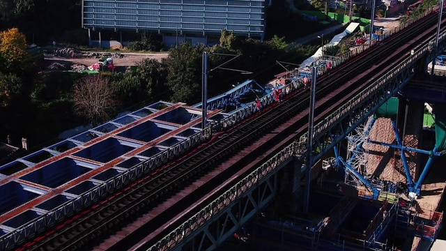 Video Reference: Building, Rolling stock, Mode of transport, Urban design, Vehicle, Track, Tower block, Railway, Rolling, Cityscape