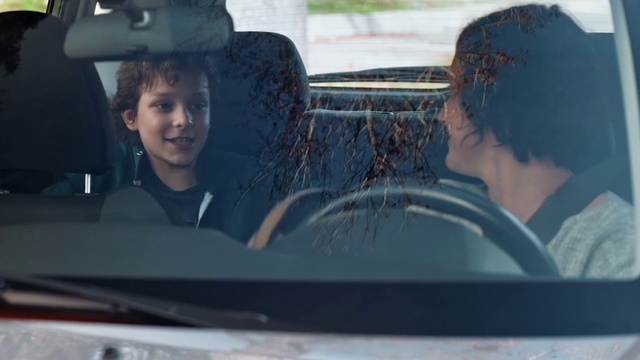 Video Reference: Land vehicle, Vehicle, Hairstyle, Motor vehicle, Facial expression, Car, Window, Hood, Automotive design, Automotive mirror