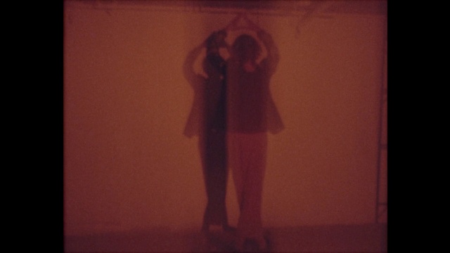 Video Reference: Flash photography, Gesture, Art, Rectangle, Font, Wood, Tints and shades, Magenta, Event, Visual arts