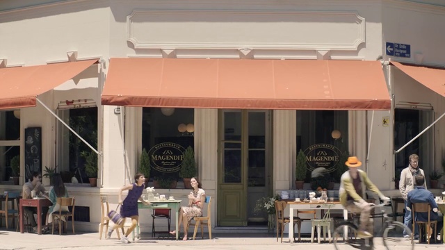 Video Reference: Clothing, Table, Chair, Shade, Dog, Awning, Leisure, Facade, Tire, Outdoor table