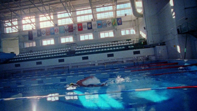 Video Reference: Water, Swimming pool, Field house, Building, Line, Leisure, Window, Swimmer, Sports, Indoor games and sports