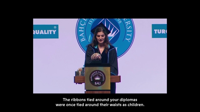 Video Reference: Smile, Font, Sleeve, Spokesperson, Electric blue, Technology, Event, Public speaking, Advertising, Speech