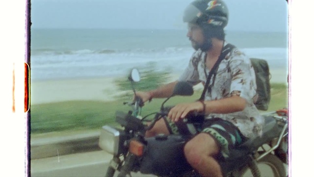 Video Reference: Water, Sky, Motor vehicle, Helmet, Vehicle, Motorcycle, Bicycle handlebar, Automotive tire, Travel, Beach