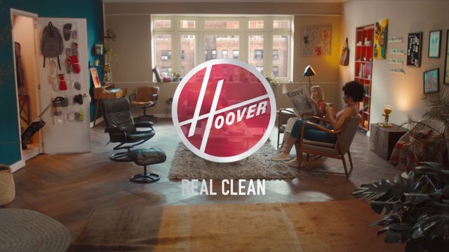 Video Reference: living room, interior, home, people, chairs, window, logo, brand, advertisement, cleaning, furniture, decor, daylight, rug, poster, text