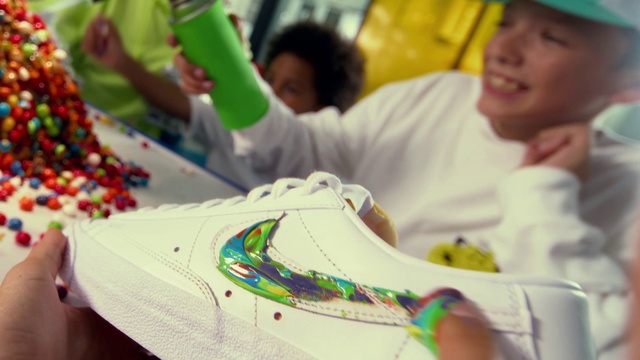 Video Reference: White, Green, Yellow, Happy, Walking shoe, Fun, Leisure, Event, Art, T-shirt