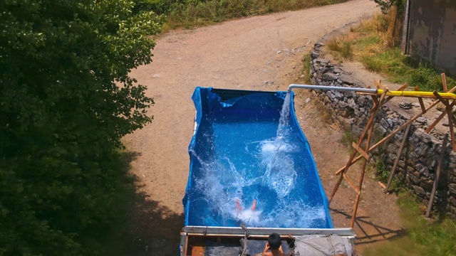 Video Reference: Plant, Water, Wood, Grass, Motor vehicle, Tints and shades, Tree, Automotive exterior, Landscape, Electric blue