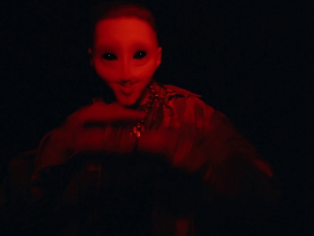 Video Reference: Smile, Sleeve, Art, Fashion design, Magenta, Toy, Electric blue, Performing arts, Darkness, Event