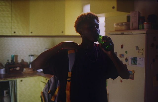 Video Reference: Bottle, Eyewear, Audio equipment, Cabinetry, Event, Kitchen appliance, T-shirt, Room, Entertainment, Countertop