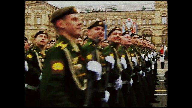 Video Reference: soldiers, military, parade, formation, uniform, marching, ceremony, historic building, outdoors, crowd, discipline, tradition
