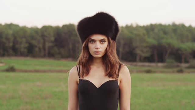 Video Reference: Hair, Face, Skin, Lip, Outerwear, Shoulder, Eye, Facial expression, Cap, Sky