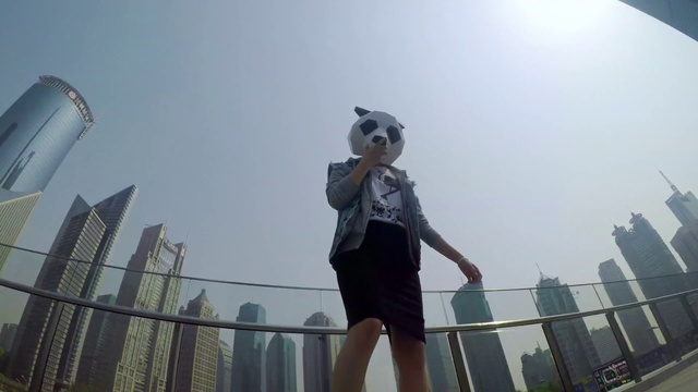 Video Reference: Sky, Daytime, Atmospheric phenomenon, Happy, Fence, Tree, Toy, City, Tower block, Street fashion