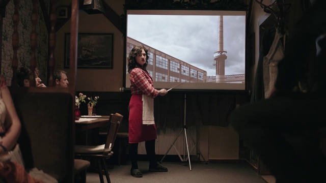 Video Reference: Chair, Entertainment, Performing arts, Event, Table, Houseplant, Design, Room, Darkness, Performance art