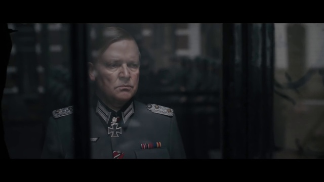 Video Reference: Flash photography, Military person, Font, Official, Non-commissioned officer, Darkness, Event, Screenshot, Photo caption, Security