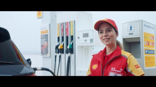 Video Reference: Smile, Workwear, Sleeve, Gesture, Motor vehicle, Gas, Engineering, Street fashion, Job, Cap