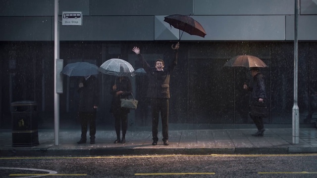 Video Reference: Umbrella, Human, Standing, Building, Grey, City, Road surface, Tints and shades, Street fashion, Urban area