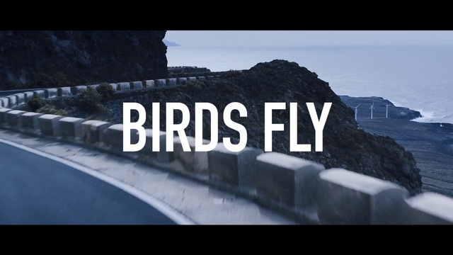 Video Reference: Sky, Font, Travel, Rectangle, Landscape, Asphalt, Natural landscape, Horizon, Mountain range, Automotive exterior