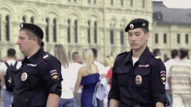 Video Reference: Clothing, Outerwear, Building, Military uniform, Military person, Security, Window, Soldier, Gesture, Headgear