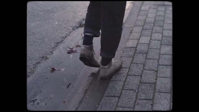 Video Reference: Shoe, Leg, Road surface, Asphalt, Grey, Wood, Black-and-white, Flooring, Floor, Thigh