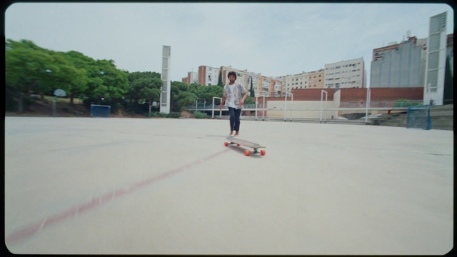 Video Reference: Sky, Sports equipment, Skateboard truck, Asphalt, Skateboarder, Building, Cloud, Skateboard, Tree, Plant