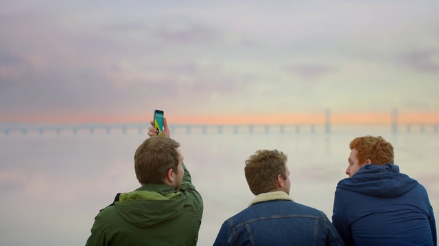 Video Reference: Clothing, Outerwear, Sky, Cloud, Vertebrate, Standing, Travel, Jacket, Atmospheric phenomenon, Horizon