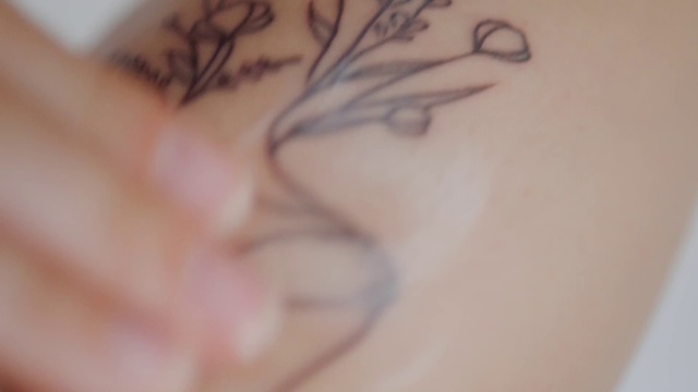 Video Reference: Eyelash, Gesture, Temporary tattoo, Chest, Tattoo, Art, Twig, Trunk, Font, Wrist