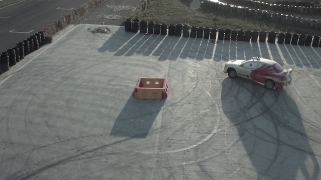 Video Reference: Tire, Wheel, Hood, Vehicle, Automotive tire, Car, Asphalt, Mode of transport, Race track, Automotive lighting