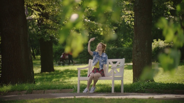 Video Reference: Plant, Furniture, Outdoor bench, Nature, Leaf, Botany, Tree, People in nature, Dress, Outdoor furniture