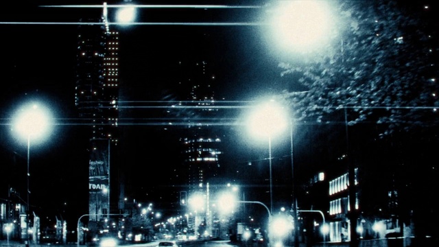 Video Reference: Atmosphere, Building, Automotive lighting, Light, Street light, Skyscraper, Electricity, Car, Line, Tower block